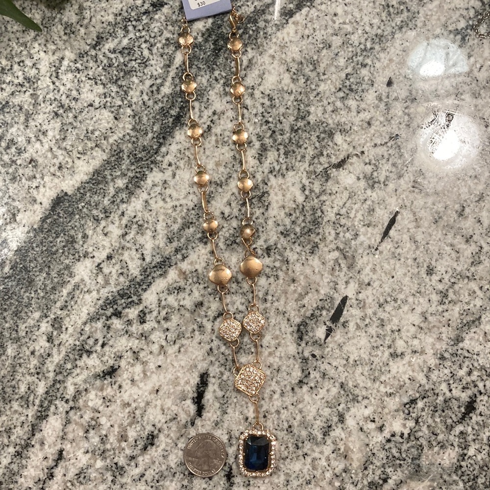 Gold necklace with blue gem